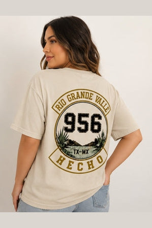 Woman wearing beige 956 El Alegre shirt with circular back design detail
