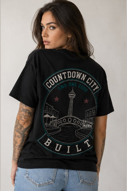Black Countdown City Built tee featuring San Antonio skyline and red stars