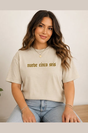 Beige Rio Grande Valley Hecho tee with gold nueve cinco seis front text